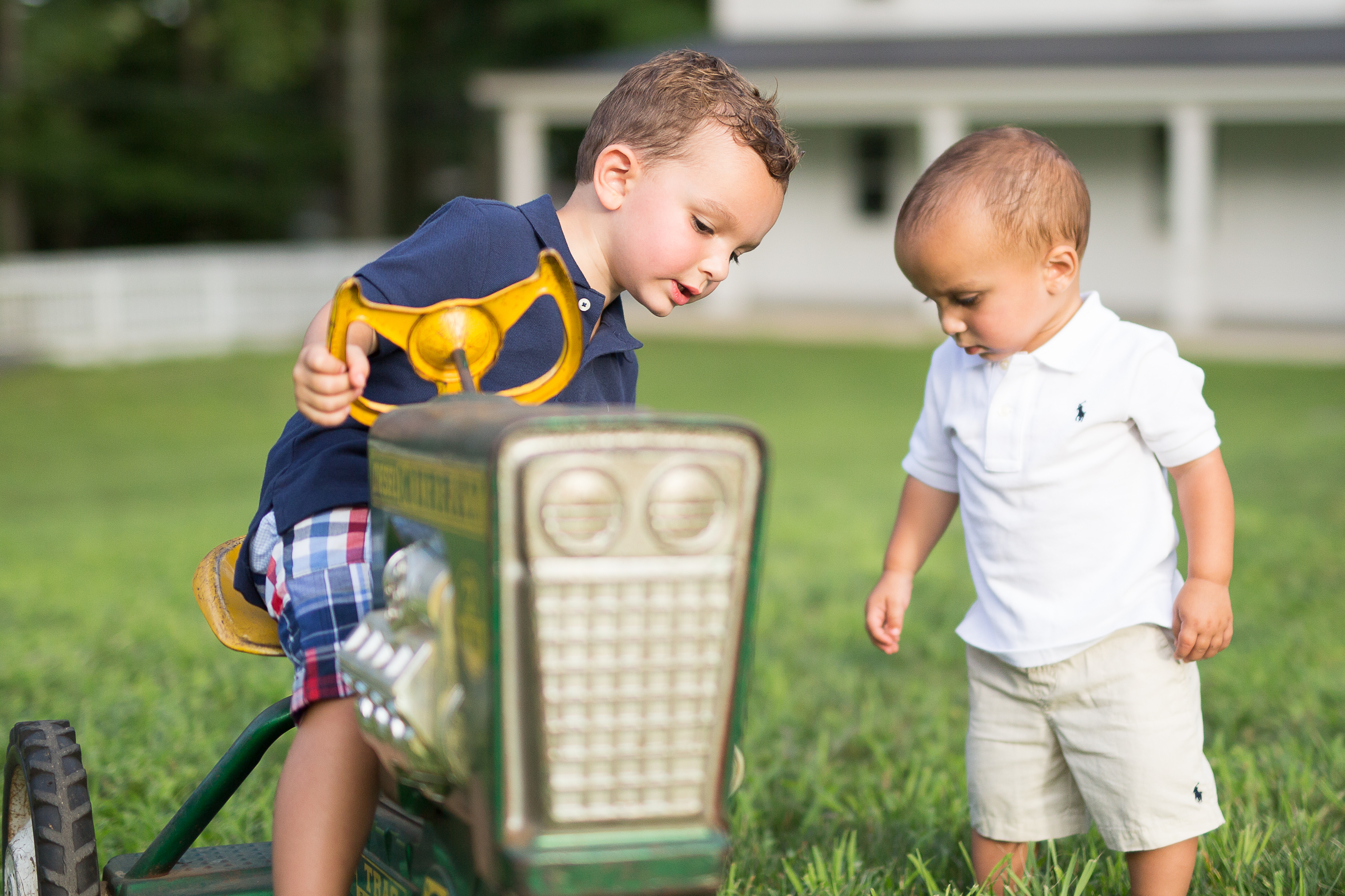 photo of two boys in the yard playing